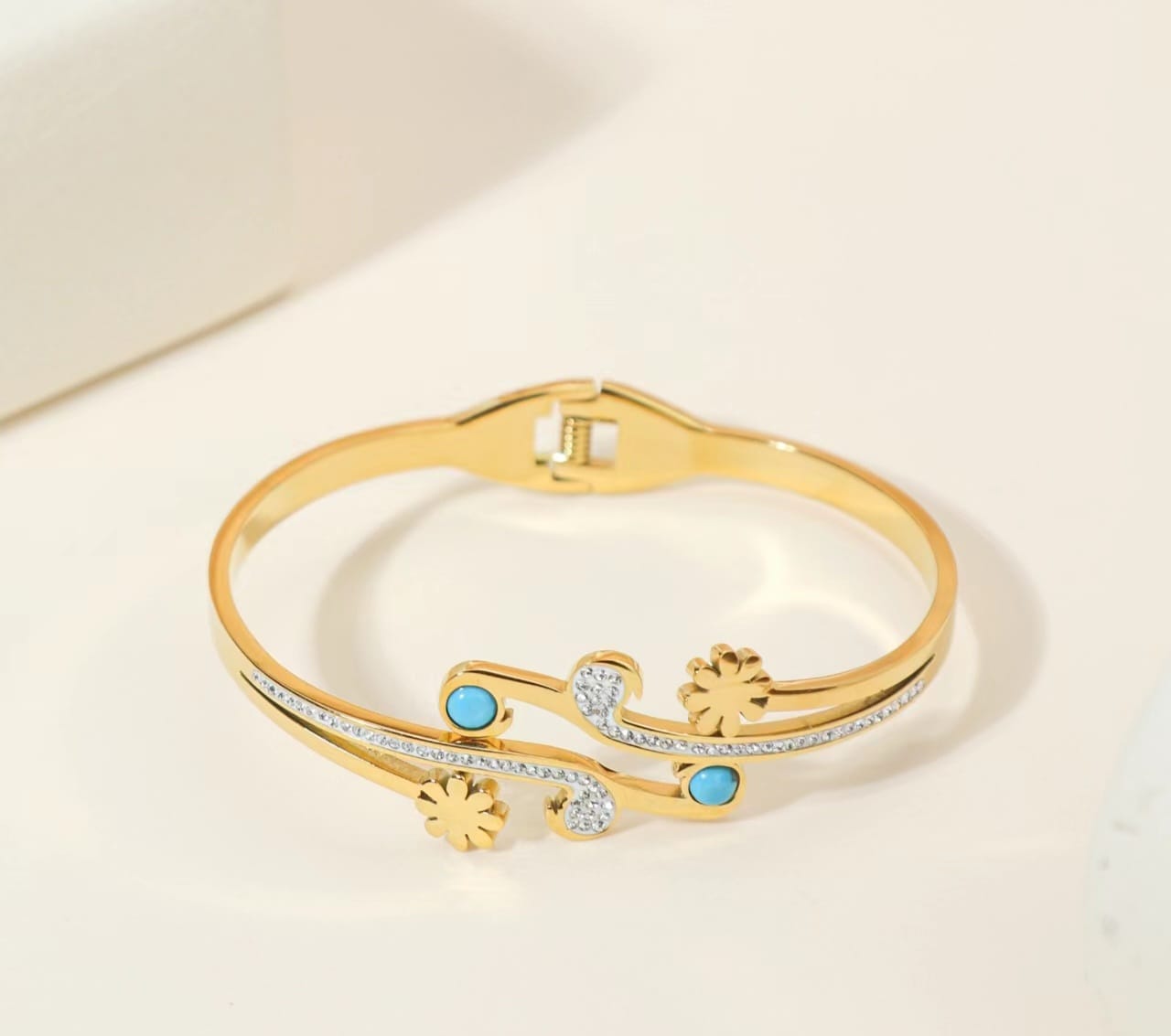 Flowery gold plated bangle bracelet